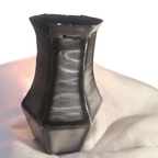 Black metal vase on a white background
