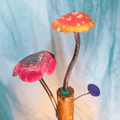 Colorful mushroom-shaped objects on a blue background