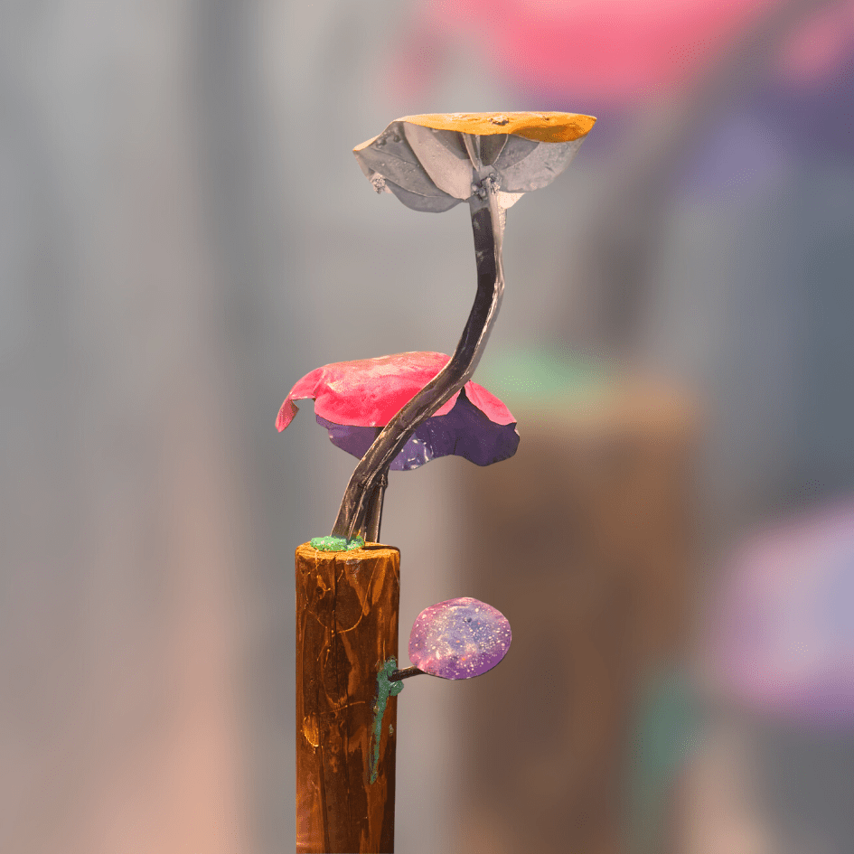 metal mushrooms on a wooden column, displayed on blurred background