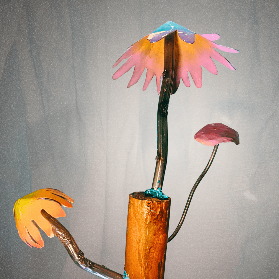 metal mushrooms on a log on a blurred background