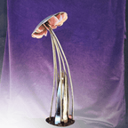 metal mushroom shaped statue, on a purple background