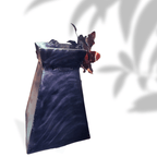 Decorative metal vase art with wavy black design on a white background