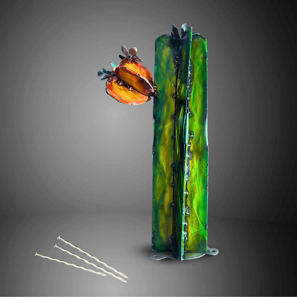 Artistic green painted metal cactus sculpture with floral elements on a gray background
