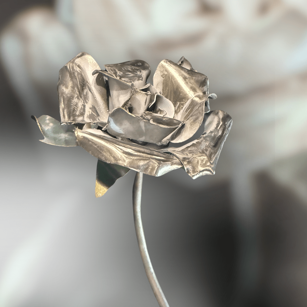 Silver and White metallic rose on a blurred background