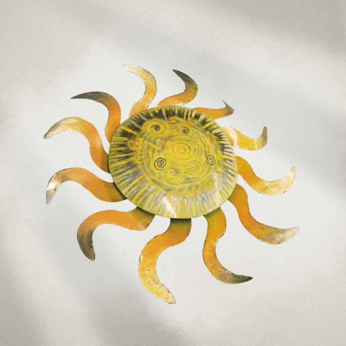 Decorative sun wall art with a yellow center and orange rays on a light gray background
