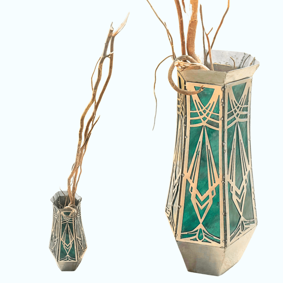 Decorative vase with geometric design with dry branches on a white background