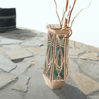 Decorative vase with geometric design on a stone surface