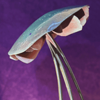 Close-up of a metallic mushroom shaped object against a purple background