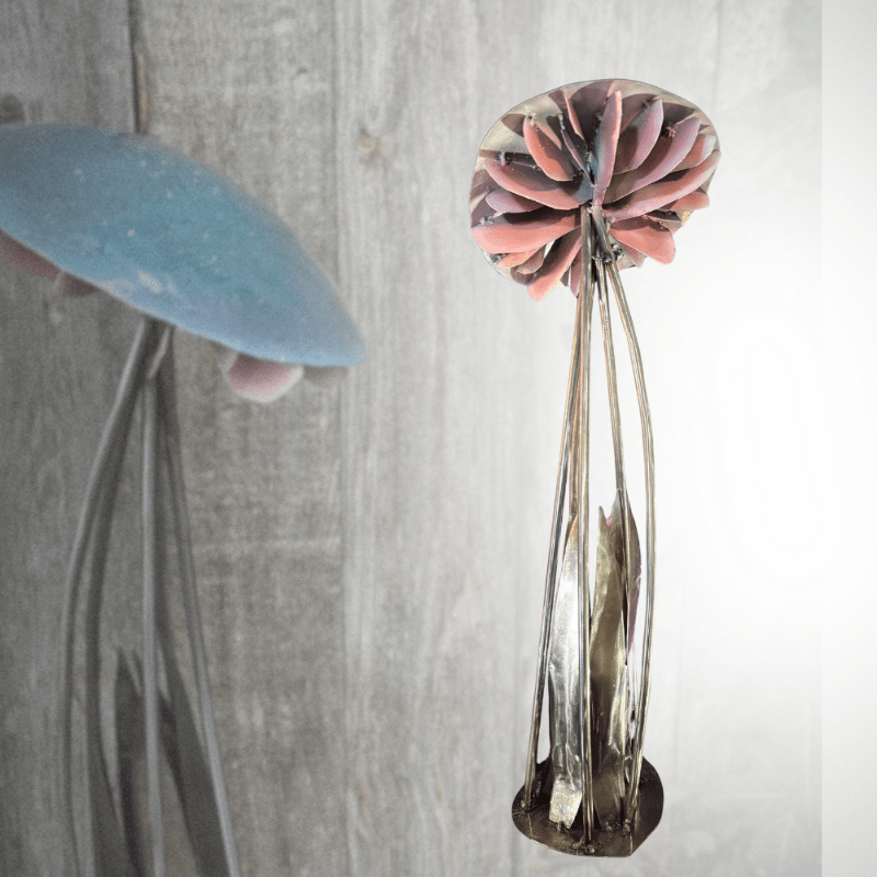Decorative mushroom made of metal with a unique design on a light gray background