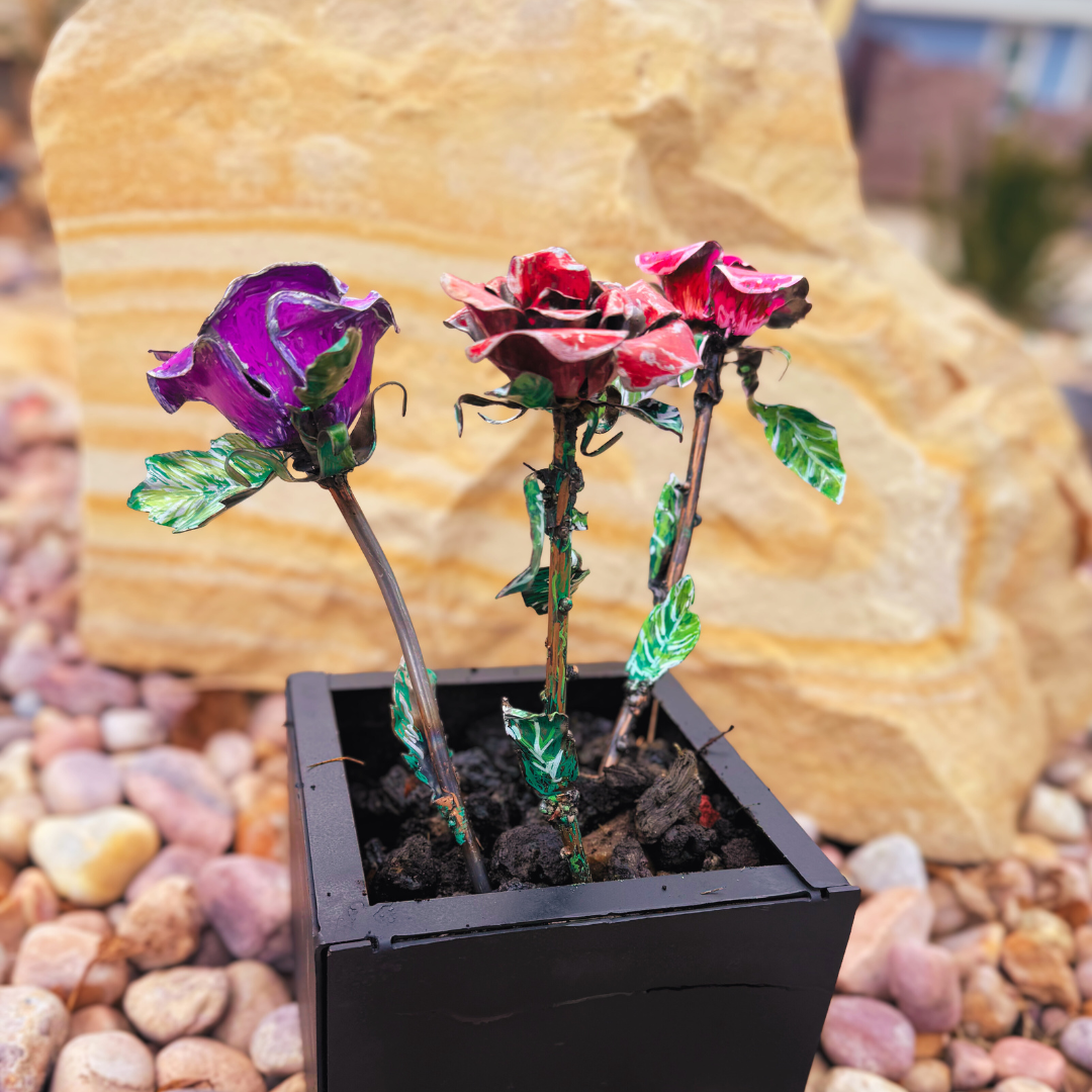 Artificial flowers in a pot with a natural stone background